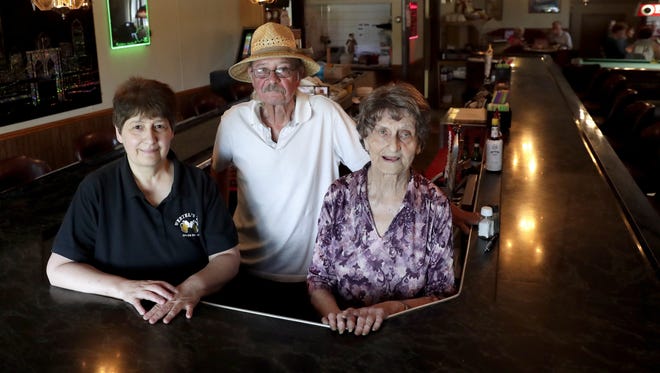 Wertel's Tap owners Sharon and Dick Wertel, and founder LaVerne Wertel, pose for a portrait inside the Bellevue tavern, which is celebrating 50 years in business.