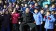  Kim Jong-Un posing with the school students while