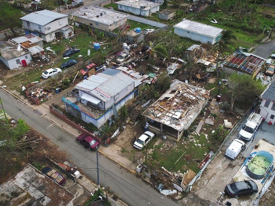 Damaged and destroyed houses in the neighborhood of