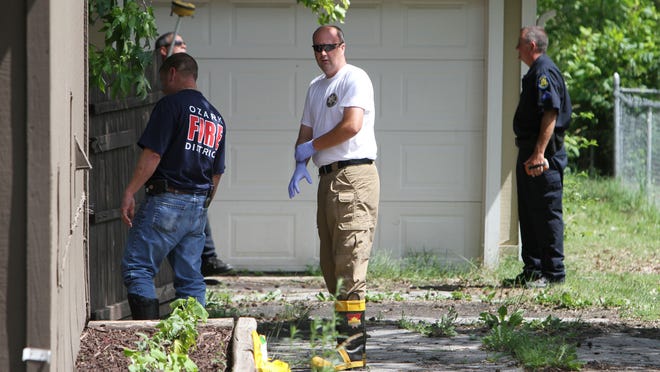 Christian county coroner Brad Cole at the scene of a fire at 1200 block E. McCracken Rd. in Ozark on Tuesday, June 17, 2014.
