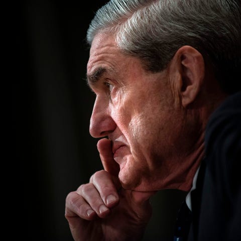 Then-FBI director Robert Mueller testifies during...