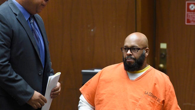 Marion "Suge" Knight, right, appears with his attorney Matthew Fletcher, left, in court for a hearing about evidence in his murder case in Los Angeles, California on March 9, 2015.