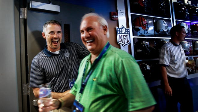 Memphis coach Mike Norvell (left) jokes with fan Doug Collins (middle) during "Open Mike Night" on July 14, 2016, at the Billy J. Murphy complex.