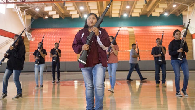 Members of Shiprock's Marine Corps Junior ROTC Armed Drill Team perform on Monday in the Chieftain Pit at Shiprock High School.