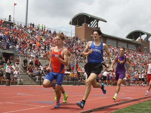 Madeira's Dylan Whitson starts off the Mustangs' 4x800
