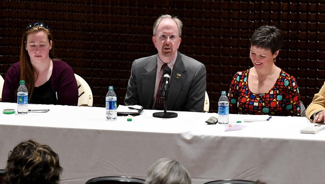 Ron Ramsey (center) fields a question during a candidate's forum in 2018.