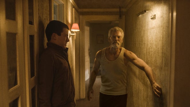 This image released by Sony Pictures shows Dylan Minnette, left, and Stephen Lang in a scene from "Dont Breathe." (Sony/Screen Gems via AP)