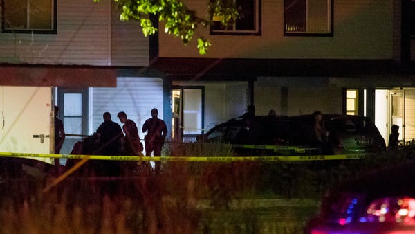 Boise police investigate at a crime scene near the