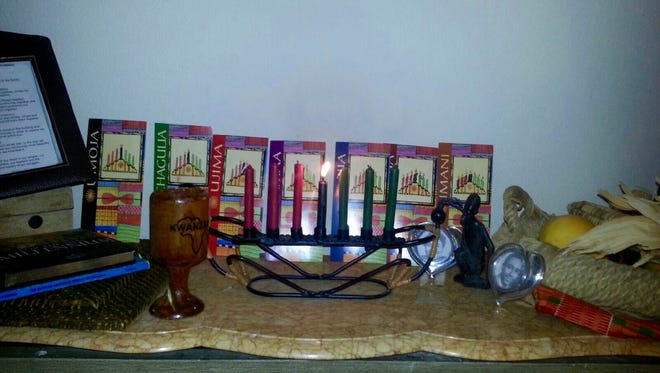 The altar in Kathryn White's Desert Hot Springs home honors the seven principles of Kwanzaa.