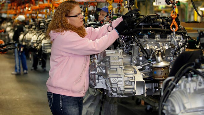 Tina Knudson works in engine assembly at the General Motors Fairfax Assembly and Stamping Plant in Kansas City, Kan.