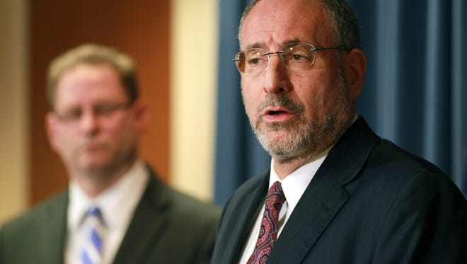 United States Attorney Andrew Luger, right, and FBI special agent Richard Thornton explain the criminal complaint charging six Minnesota men with terrorism at a news conference in Minneapolis, on Monday April 20, 2015. The six, whom authorities described as friends who met secretly to plan their travels, are accused of conspiracy to provide material support and attempting to provide material support to a foreign terrorist organization. The complaint says the men planned to reach Syria by flying to nearby countries from Minneapolis, San Diego or New York City, and lied to federal investigators when they were stopped.