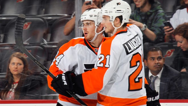 Matt Read, left, and Scott Laughton will both be fighting for roster spots when the Flyers open training camp next month.
