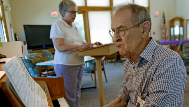 Herb Spomer plays piano as Ida Jeanne Smith leads the group in song at The Village at Luther Ridge on Monday, June 20, 2016, during Longest Day, an event to bring awareness to Alzheimer's disease. Events like singing and riding a Nu-Step cardio cycle helped symbolize the challenging journey of those living with the disease and dementia, as well as their caregivers.The event is held each year on the summer solstice, which is the longest day of the year.