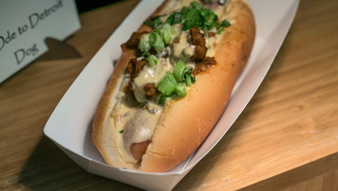 An Ode to Detroit Dog  with natural casing hot dog smothered in brisket chili, drizzled with habanero queso cheese sauce and topped with green onions is seen on display on Friday, March 23, 2018 during the Detroit Tigers concessions sneak peek at Comerica Park in Detroit.
