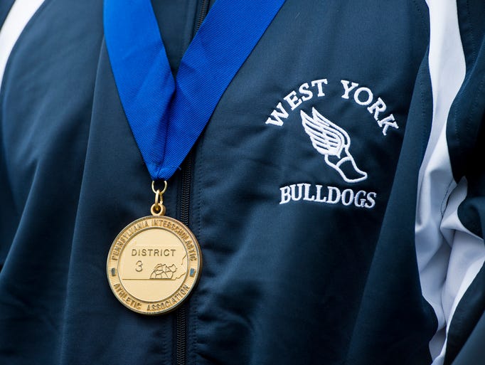 West York's Luke Hoffman's first-place medal hangs