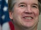 Supreme Court nominee Brett Kavanaugh stands with Sen.