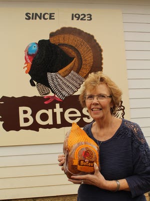 Becky Sloane holds one of Bates Turkey Farm’s last gobblers at the Lowndes County processing plant. Alvin Benn/Special to the Advertiser