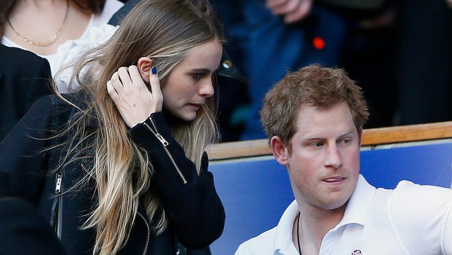 Britain's Prince Harry and Cressida Bonas attend England's Six Nations international rugby union match against Wales at Twickenham in London March 9, 2014. REUTERS/Stefan Wermuth (BRITAIN - Tags: SPORT RUGBY ROYALS) ORG XMIT: SWT04