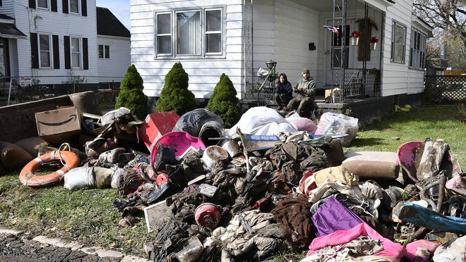 This 2019 file photo shows some of the aftermath of severe flooding that took place Oct. 31 along Gardner Street in Whitesboro.