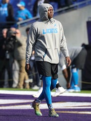 Lions' Ziggy Ansah warms up before playing the Baltimore