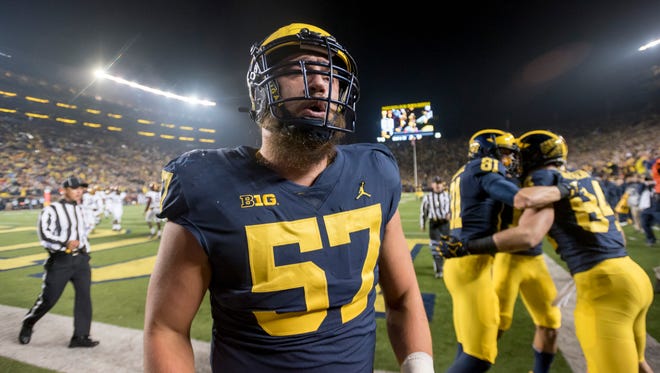 Patrick Kugler will help coach the offensive line as a graduate assistant at Michigan next season.