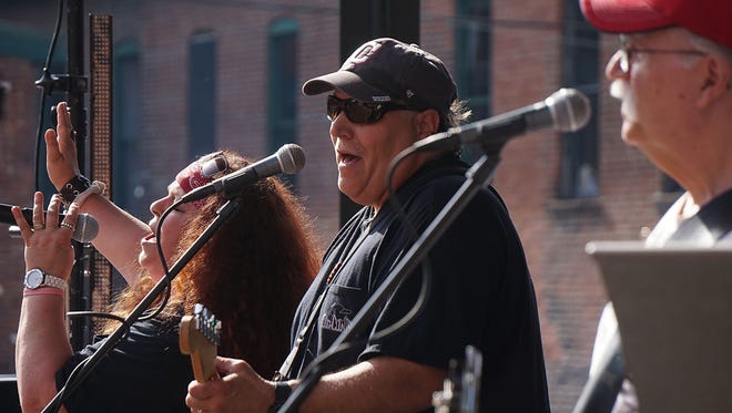 Members of Thee Rough Country Band perform during a Final Friday Concert Series concert at the Brickyard in downtown Mansfield.