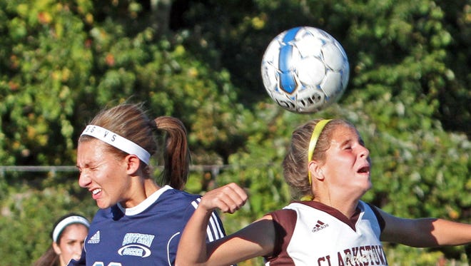Clarkstown South's Abby Montera beats Suffern's Jayne Goldman to the ball during a varsity soccer game at Clarkstown South High School Oct. 6, 2015. Clarkstown South handed Suffern it's first loss of the season with a 4-1 victory.