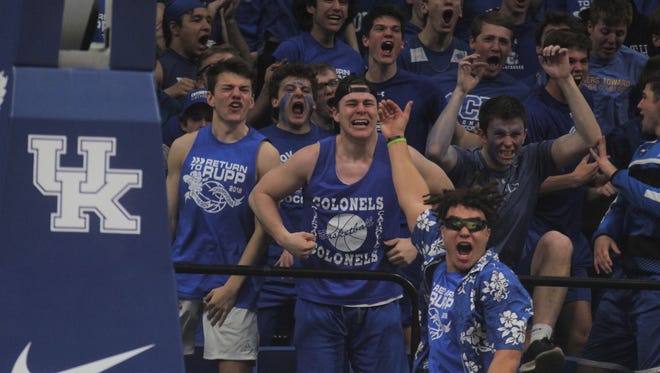 CovCath students get fired up after a dunk by Nick Thelen in the first half during the KHSAA Sweet 16 boys basketball matchup between Covington Catholic and Apollo on March 15, 2018, at Rupp Arena, Lexington, Ky.