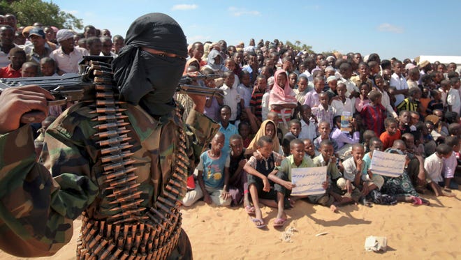 An armed member of the militant group al-Shabab attends a rally on the outskirts of Mogadishu, Somalia, on Feb. 13, 2012.