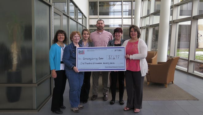 The Church Mutual Employees’ Association recently donated a check for $1,677 to the Merrill Community Warming Center. Pictured, from left, are Rose Skic from the association, warming center representative Dee Olsen, and association members Promise Lohse, Brian Seeger, Wendy Smith and Laurie Thiel.