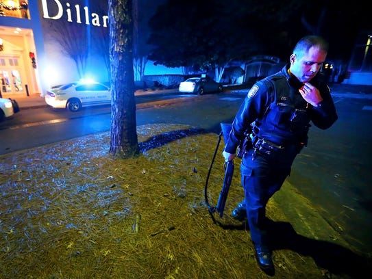 MPD officers block off the entrances to the Oak Court