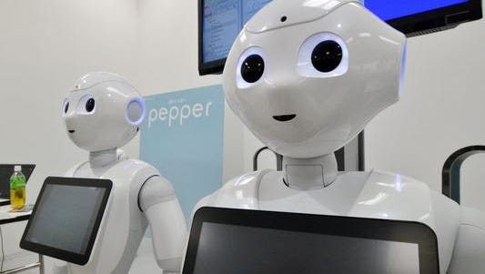 Japanese mobile communication giant Softbank's humanoid robot "Pepper" is displayed at a high-tech gadgets exhibition in Tokyo.