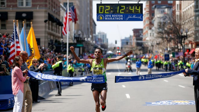 Apr 18, 2016; Boston, MA, USA; Lemi Berhanu Hayle of Ethiopia crosses the finish line to win the 120th Boston Marathon. Mandatory Credit: Greg M. Cooper-USA TODAY Sports