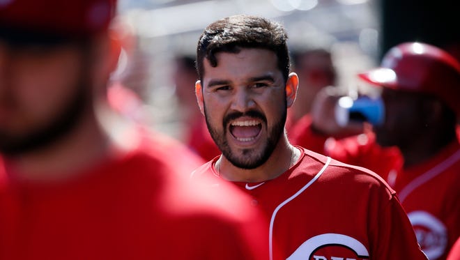 Cincinnati Reds third baseman Eugenio Suarez (7) cheers in the dugout before the first inning of the MLB Spring Training game between the Cleveland Indians and the Cincinnati Reds at Goodyear Ballpark in Goodyear, Ariz., on Saturday, Feb. 25, 2017.
