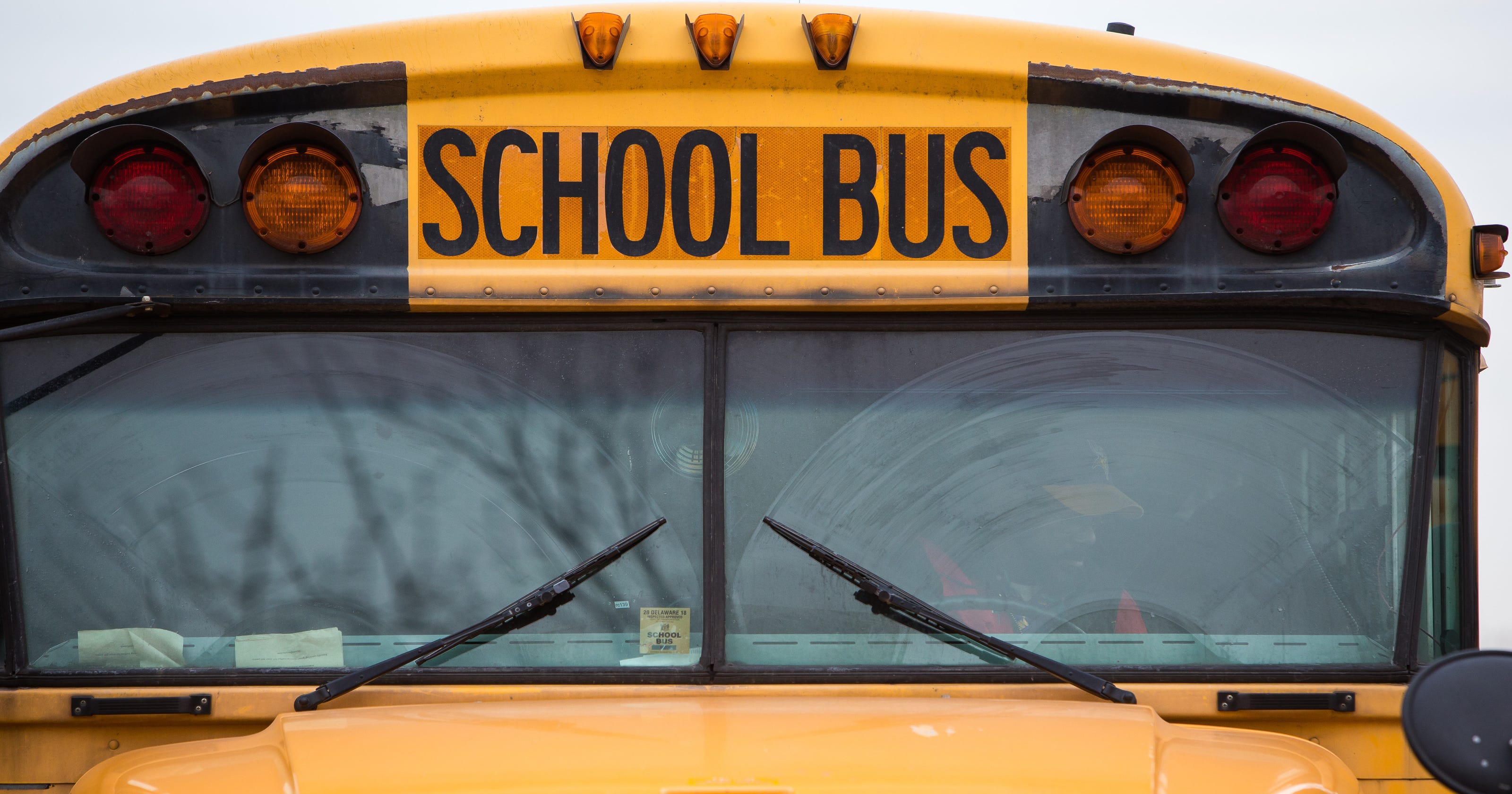 School bus driver fired after crossing tracks