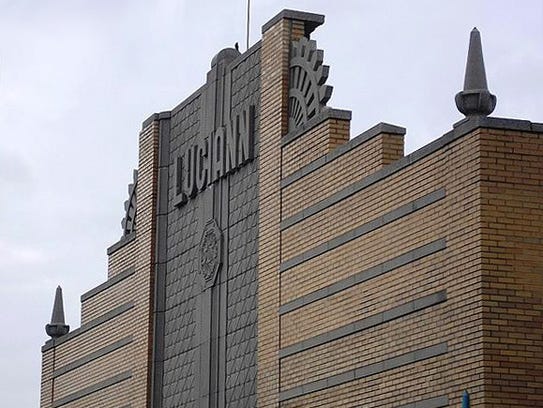 The ornate upper facade of the Paris Adult Theatre