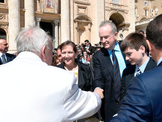 Pope Francis shaking hands with Bill O'Reilly during