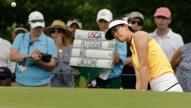 Michelle Wie chips onto the seventh green during the first round of the U.S. Women's Open Golf tournament Thursday, July 13, 2017, in Bedminster, N.J. (AP Photo/Seth Wenig)