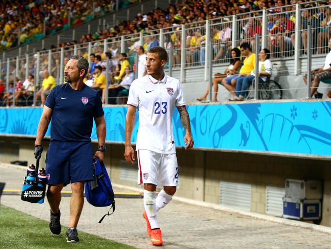 United States defender Fabian Johnson leaves the field with a trainer after suffering an injury against Belgium during the round of sixteen match in the 2014 World Cup at Arena Fonte Nova.