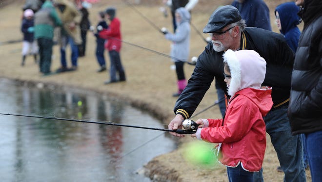 Testing the waters during a demo at a free open house at the Pequest Trout Hatchery in 2014.