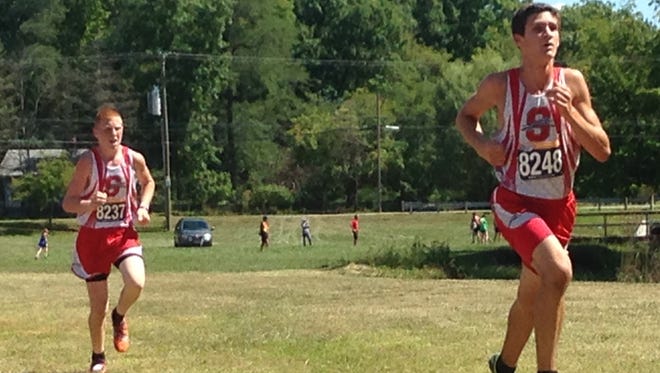 Shelby cross country runners Caleb Brown and Sam Logan help the Whippets win at the Ashland Invitational with top-10 finishes on Saturday.