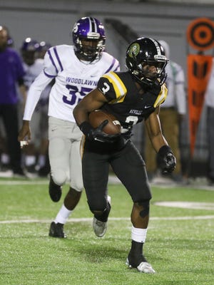 Neville's Josh Diarse runs the ball during the Tigers' first postseason game against Baton Rouge's Woodlawn Panthers on Friday, Nov. 11, 2016.