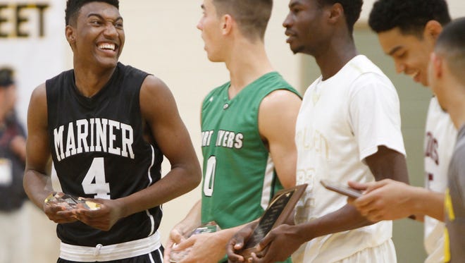 Mariner's Rodney Hunter, left, shares a laugh and a Mister Basketball award with Fort Myers player Mark Matthews, center, at the SFABC Boys & Girls All Star Game Monday in Fort Myers.