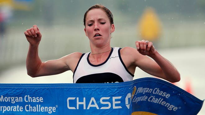 
Morgan Burrows, who will race again this year, breaks the women’s tape first during the 2010 Corporate Challenge. 


