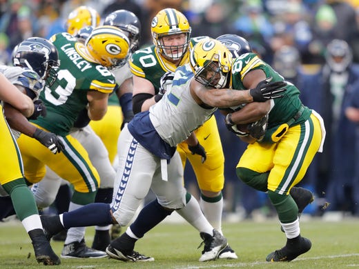 Green Bay Packers' Ty Montgomery is tackled by Seattle