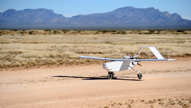An unmanned aerial vehicle (UAV) from the NMSU Unmanned Aircraft Systems Flight Test Center (UAS FTC) makes its way down the runway on the Jornada Experimental Range.