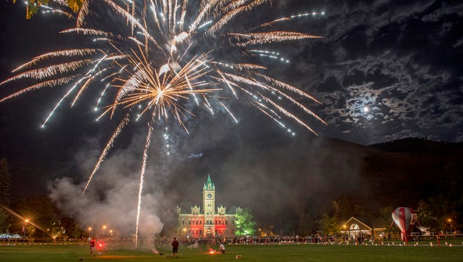 Fireworks erupt above the University of Montana in Missoula during a Homecoming celebration.
