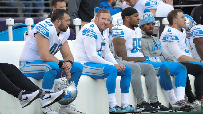 Lions players sit on the bench during the fourth quarter of the Lions' 44-20 loss on Sunday, Dec. 3, 2017, in Baltimore.