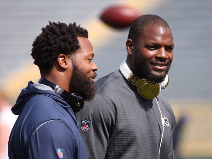 Seattle Seahawks defensive end Michael Bennett (left)