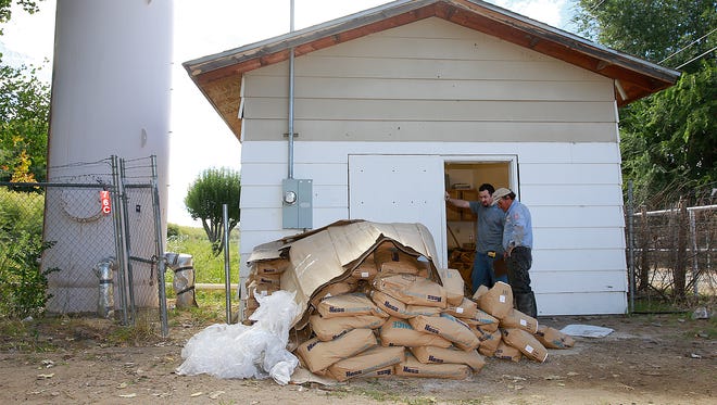 Work continues on a filtration system in the Harvest Gold water system east of Bloomfield on Tuesday.